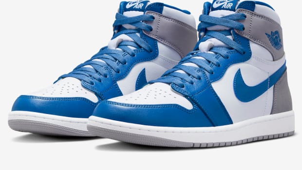 View of blue, white, and grey Air Jordan shoes.